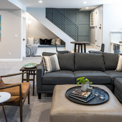 Mid-sized transitional look-out carpeted, gray floor and wood wall basement photo in Denver with a bar and gray walls