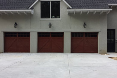 Large beach style attached three-car garage photo in Charleston