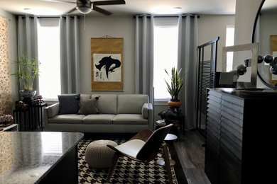 Small zen formal and open concept laminate floor and gray floor living room photo in Orange County with gray walls and a tv stand