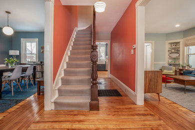 Design ideas for a small classic foyer in Cleveland with multi-coloured walls and light hardwood flooring.