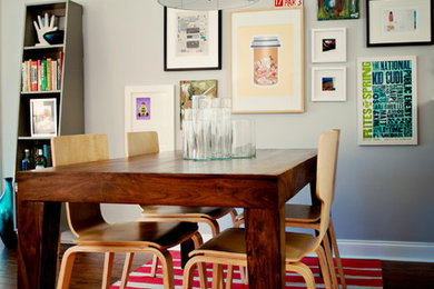 This is an example of a large eclectic dining room in Other with grey walls, dark hardwood floors and no fireplace.