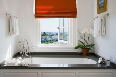 Large trendy master alcove bathtub photo in New York with white walls