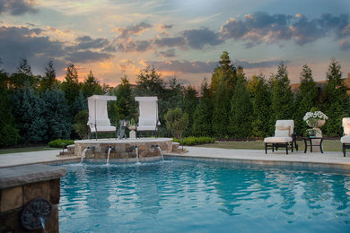 Mid-sized trendy backyard tile and rectangular lap pool fountain photo in Other