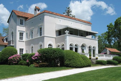 Example of a tuscan exterior home design in New York