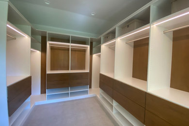 Modern Master Closet with Lighting and Drawers