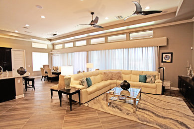 Huge trendy open concept porcelain tile and gray floor family room photo in Phoenix with gray walls, no fireplace and a wall-mounted tv