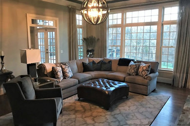 Example of a transitional dark wood floor family room design in DC Metro with gray walls, a standard fireplace and a stone fireplace