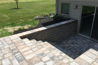 Medium sized traditional back patio in Other with no cover.