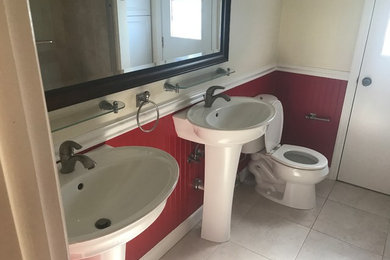 Inspiration for a small cottage 3/4 porcelain tile and white floor bathroom remodel in Tampa with a two-piece toilet, multicolored walls and a pedestal sink
