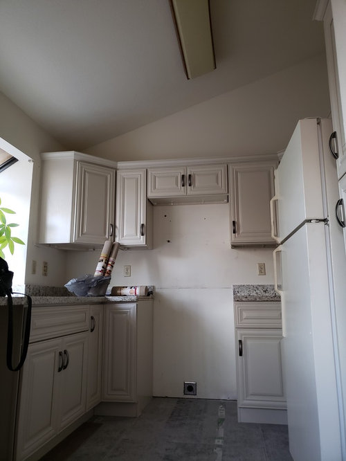 Lighting for kitchen with vaulted ceiling.