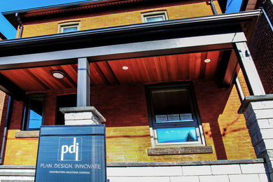 Inspiration for a transitional red brick exterior home remodel in Toronto