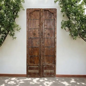 More is More: Moody Blue Carved Doors in Mogul Interior Wellness Decor