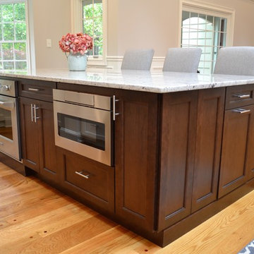 Kitchen with Dark Brown Island with White Granite Countertop