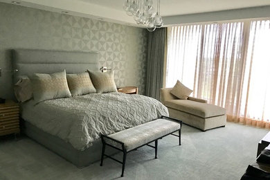 Example of a large classic master carpeted bedroom design in Miami with no fireplace
