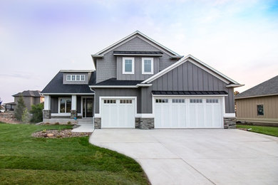 Mid-sized transitional gray two-story mixed siding exterior home photo in Other with a mixed material roof