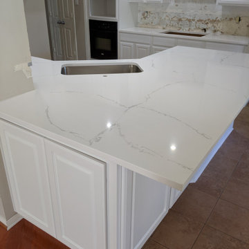 White kitchen - calcatta quartz, Salerno tile and extended cabinetry