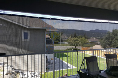 Example of a mid-sized trendy home design design in Vancouver