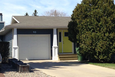 Inspiration for a mid-sized transitional blue one-story concrete fiberboard exterior home remodel in Other