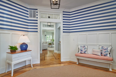 This is an example of a mid-sized beach style foyer in Portland Maine.