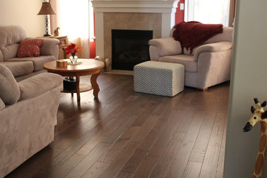 Mid-sized elegant formal and enclosed dark wood floor and brown floor living room photo in Toronto with orange walls, a standard fireplace, a tile fireplace and no tv