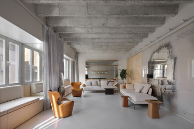 Idee per un grande soggiorno moderno stile loft con pareti bianche, pavimento in cemento e pavimento grigio