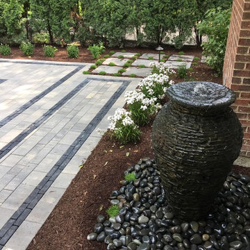 Outdoor Living Space with Gas Fire Pit and Lush Landscapes