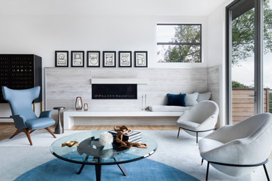 Mid-sized trendy formal and open concept light wood floor living room photo in San Francisco with white walls