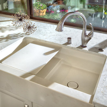 Custom Corian apron front shelf sink.