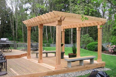 Inspiration for a mid-sized backyard deck remodel in Seattle with a pergola
