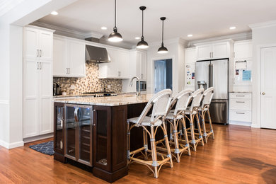 Example of a huge classic l-shaped medium tone wood floor eat-in kitchen design in Providence with a single-bowl sink, shaker cabinets, white cabinets, granite countertops, beige backsplash, mosaic tile backsplash, stainless steel appliances and an island