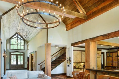 Inspiration for a mid-sized country open concept living room in Nashville with white walls and medium hardwood floors.