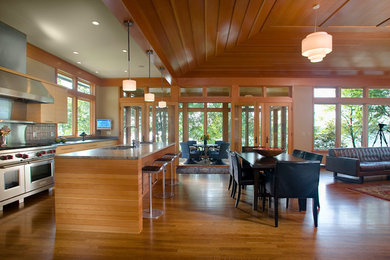 Large transitional medium tone wood floor and brown floor kitchen/dining room combo photo in Minneapolis with brown walls and no fireplace