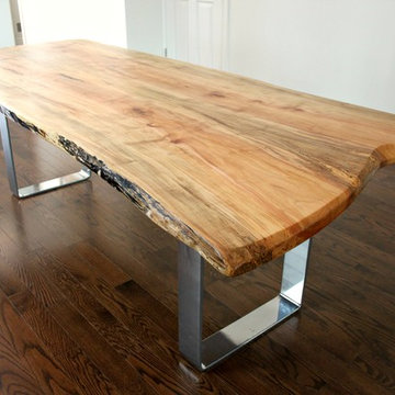 Live edge maple dining table with custom chrome base created for Toronto client