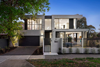 Design ideas for an expansive contemporary two-storey concrete grey house exterior in Melbourne with a flat roof.