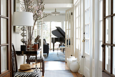 Transitional medium tone wood floor and brown floor entry hall photo in San Francisco with gray walls and a white front door