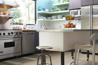 Eat-in kitchen - large contemporary l-shaped light wood floor eat-in kitchen idea in San Francisco with white backsplash, subway tile backsplash, stainless steel appliances, an island, flat-panel cabinets, an undermount sink, purple cabinets and marble countertops