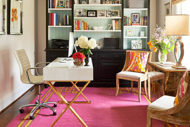 Inspiration for a timeless freestanding desk dark wood floor study room remodel in Charlotte with beige walls