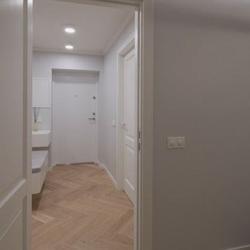 Heringbone Parquet Flooring "INVISIBLE" in white painted hallway