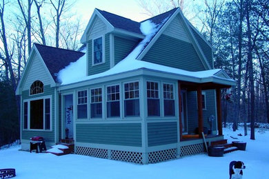 Example of a mountain style home design design in Portland Maine