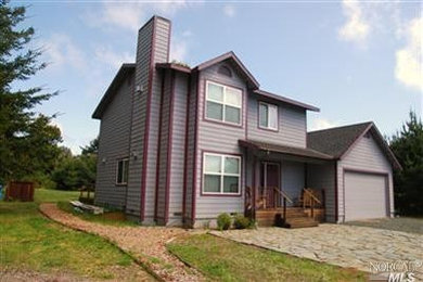 Inspiration for a mid-sized timeless gray two-story concrete fiberboard exterior home remodel in San Francisco
