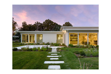 Example of a large minimalist glass exterior home design in New York