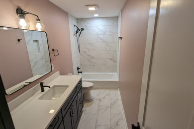 Example of a minimalist white tile and ceramic tile ceramic tile, white floor and single-sink bathroom design in Kansas City with shaker cabinets, blue cabinets, a bidet, pink walls, an undermount sink, quartzite countertops, white countertops, a niche and a built-in vanity