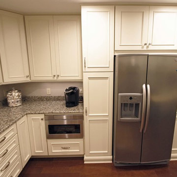 Medallion Painted White Chocolate Kitchen Cabinets with Petal Mosaic Backsplash