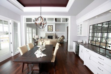 This is an example of a traditional dining room in Minneapolis with dark hardwood floors.