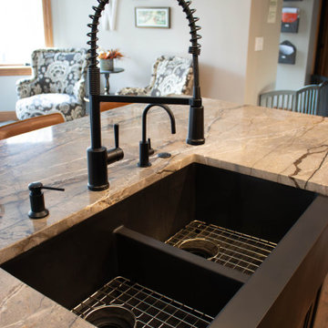 Reconfigured kitchen with new islands, countertops, backsplash
