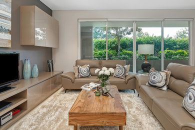 Photo of a mid-sized contemporary living room in Sydney.