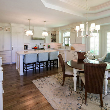 White Kitchen with Gray Quartz Countertops, Farmhouse Sink and Hardwood Floors
