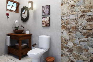 Small island style 3/4 beige tile and ceramic tile ceramic tile doorless shower photo in Other with beaded inset cabinets, dark wood cabinets, a two-piece toilet, gray walls, a vessel sink and wood countertops
