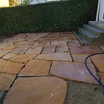 During the process: Removed all existing concrete and installing new patio.