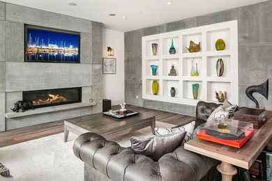 Inspiration for a mid-sized contemporary formal and open concept medium tone wood floor living room remodel in Seattle with white walls, a ribbon fireplace, a concrete fireplace and a wall-mounted tv